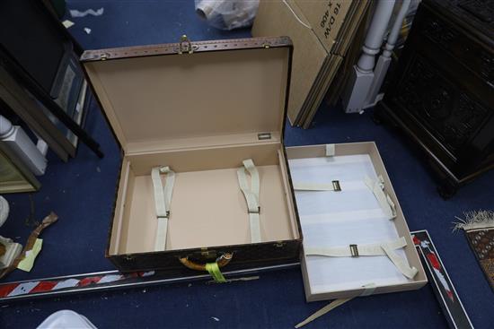 A Louis Vuitton suitcase, 25.75 x 17.5 x 8.5in.